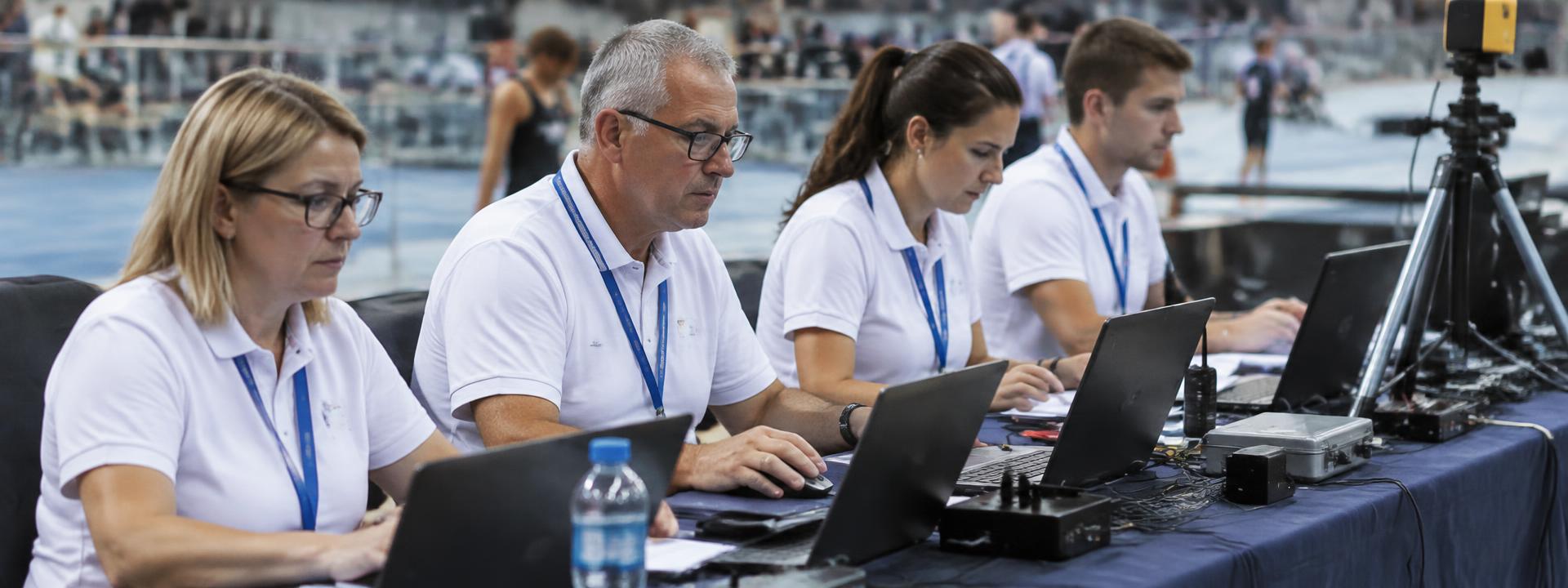 Competition officials at the control desk of a sports event